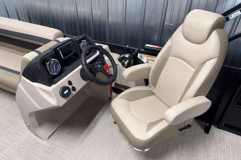 Slide: The Image of Captain's chair and helm of 2026 Premier 200 Sunscape RL boat, featuring modern controls. - 14