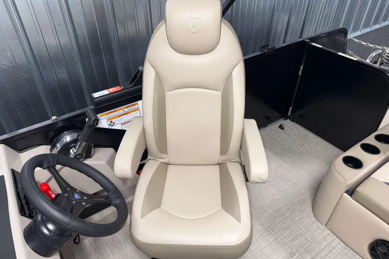 Slide: The Image of Captain's chair and steering wheel of 2026 Premier 200 Sunscape RL boat. - 15
