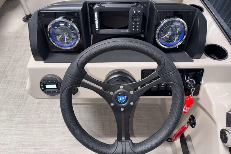 Slide: The Image of Steering console of 2026 Premier 200 Sunscape RL boat with gauges and controls. - 16