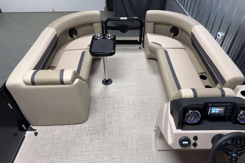 Slide: The Image of Luxurious interior of 2026 Premier 200 Sunscape RL pontoon boat with plush seating and modern dashboard. - 20
