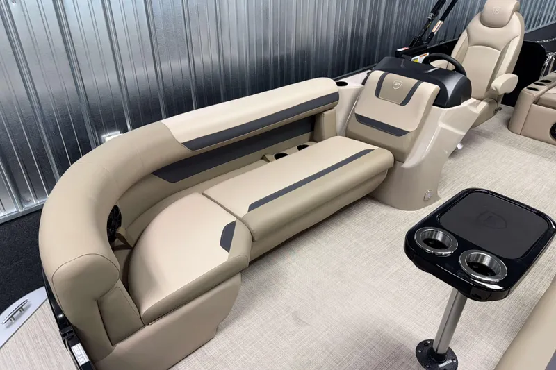 Slide: The Image of Luxurious interior of 2026 Premier 200 Sunscape RL boat with beige seating and cup holders. - 22