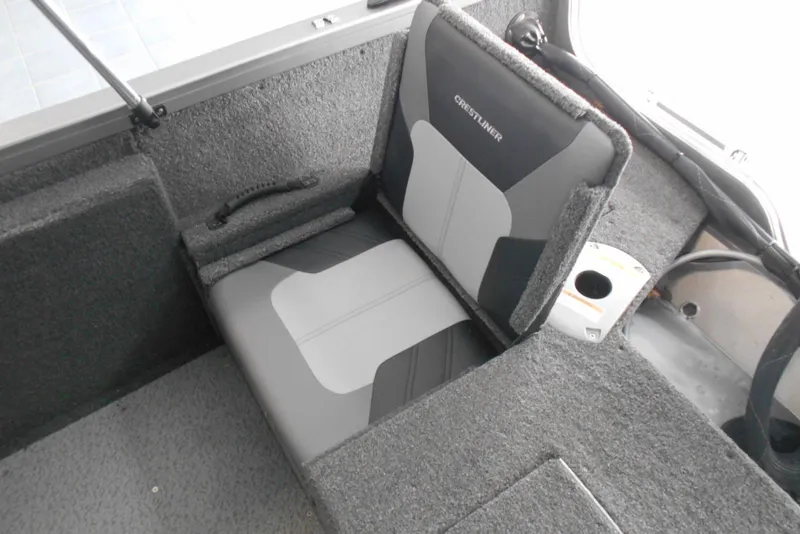 Slide: The Image of 2021 Crestliner 1650 Fish Hawk WT JS boat seat with gray upholstery and cup holder. - 11