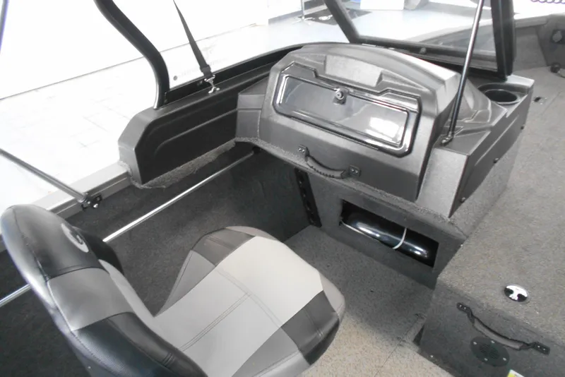 Slide: The Image of 2021 Crestliner 1650 Fish Hawk WT JS interior with seating and dashboard. - 13