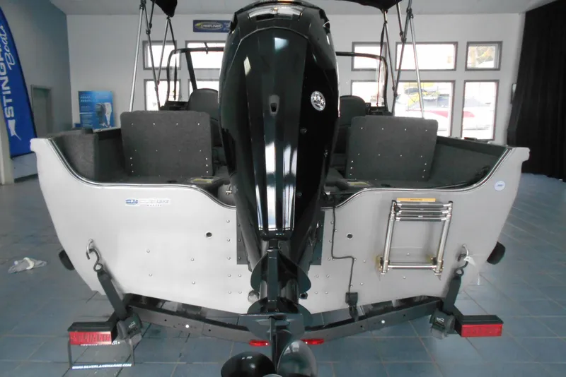 Slide: The Image of 2021 Crestliner 1650 Fish Hawk WT JS boat rear view in showroom. - 15