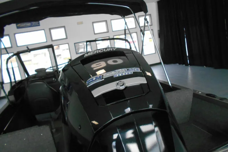 Slide: The Image of 2021 Crestliner 1650 Fish Hawk WT JS with Mercury 90 engine in showroom. - 16