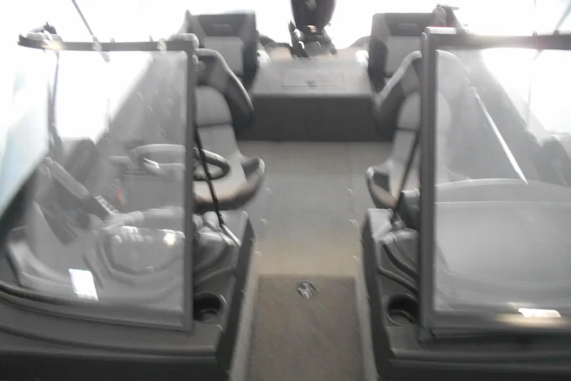 Slide: The Image of 2021 Crestliner 1650 Fish Hawk WT JS interior with dual consoles and seating. - 5