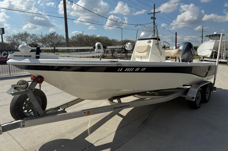 Slide: The Image of 2018 NauticStar boat on trailer under blue sky with clouds. - 3