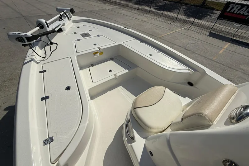 Slide: The Image of 2018 NauticStar boat interior with seating and storage compartments. - 8