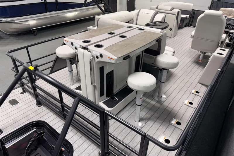 Slide: The Image of 2026 Sylvan MIRAGE X3 DLZ BAR pontoon boat interior with bar seating and modern design. - 15