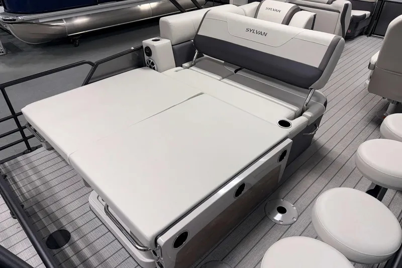 Slide: The Image of 2026 Sylvan MIRAGE X3 DLZ BAR pontoon boat with luxurious seating and modern design. - 16