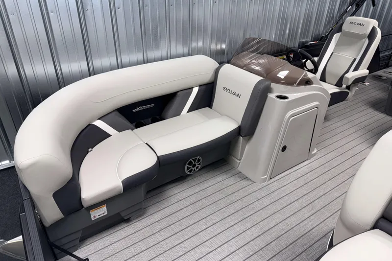 Slide: The Image of 2026 Sylvan MIRAGE X3 DLZ BAR boat interior with plush seating and modern helm. - 19