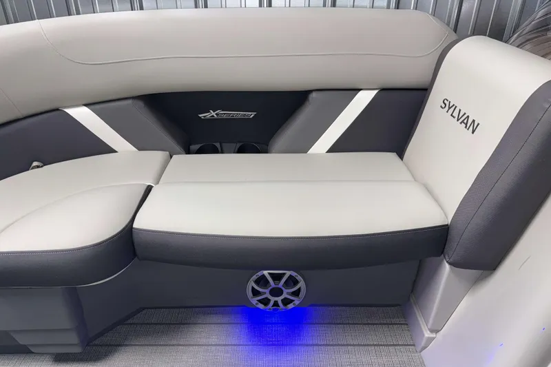 Slide: The Image of 2026 Sylvan MIRAGE X3 DLZ BAR boat interior with sleek seating and ambient lighting. - 20