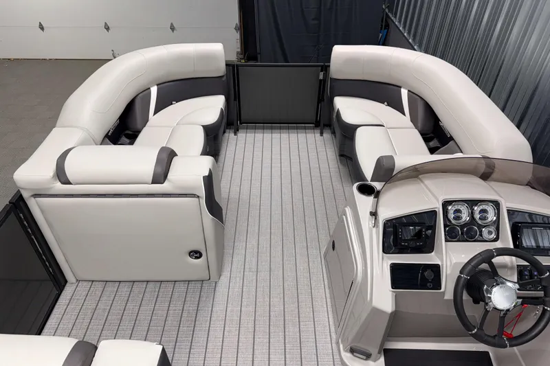 Slide: The Image of Luxurious interior of 2026 Sylvan MIRAGE X3 DLZ BAR pontoon boat with plush seating. - 4