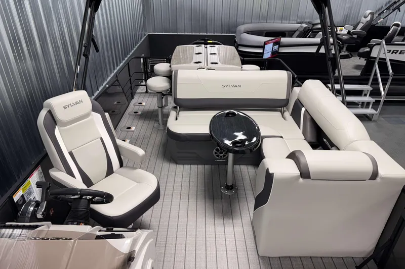 Slide: The Image of 2026 Sylvan MIRAGE X3 DLZ BAR pontoon boat interior with luxurious seating and sleek design. - 5