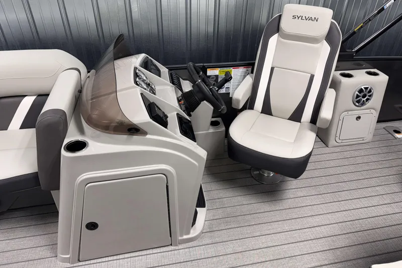Slide: The Image of 2026 Sylvan MIRAGE X3 DLZ BAR boat interior with modern helm and comfortable seating. - 6