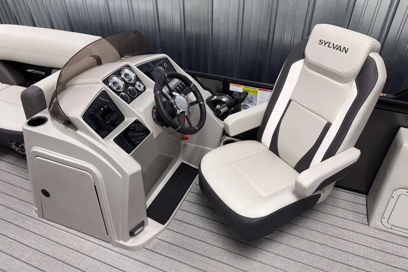 Slide: The Image of 2026 Sylvan MIRAGE X3 DLZ BAR boat interior with steering console and captain's chair. - 7