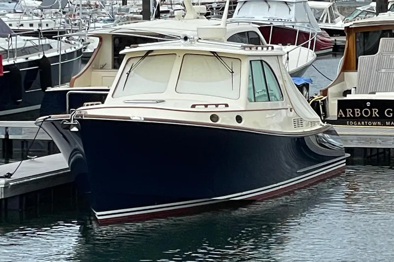 Slide: The Image of 2017 Hinckley Picnic Boat 37 MKIII docked in a marina. - 10