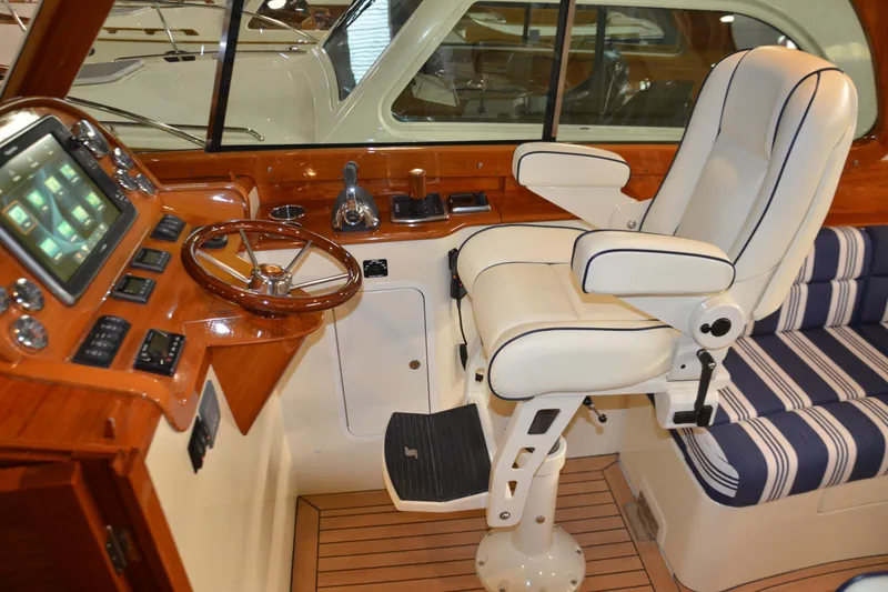 Slide: The Image of 2017 Hinckley Picnic Boat 37 MKIII helm with luxurious seating and advanced controls. - 15