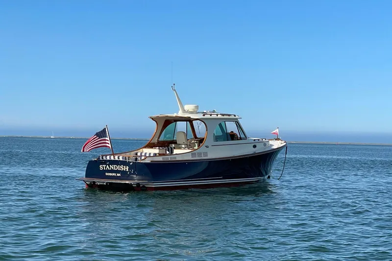 Slide: The Image of 2017 Hinckley Picnic Boat 37 MKIII on calm blue water under clear sky. - 4