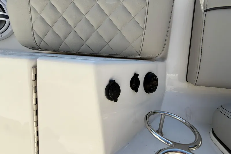 Slide: The Image of 2024 Pursuit S 328 Sport boat interior with quilted seat and control panel. - 21