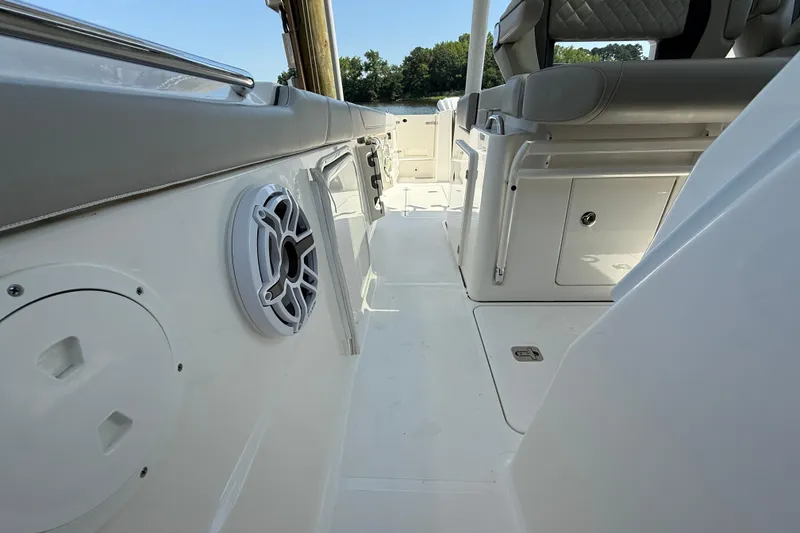 Slide: The Image of 2024 Pursuit S 328 Sport boat interior with seating and speaker detail. - 29