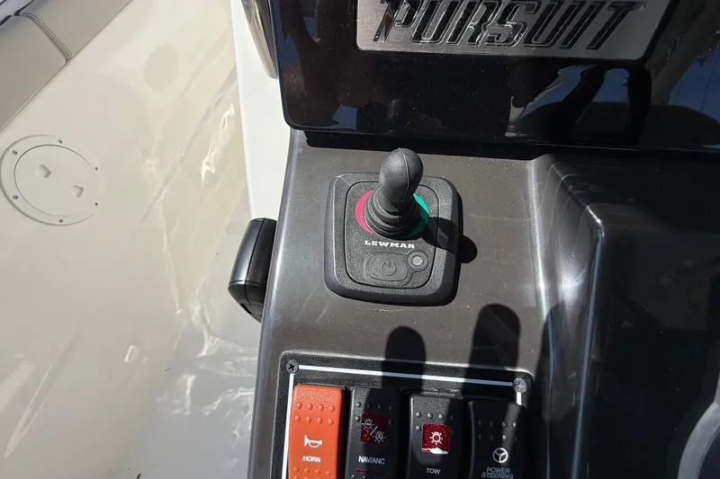 Slide: The Image of Control panel of 2024 Pursuit S 328 Sport boat with Lewmar joystick. - 40