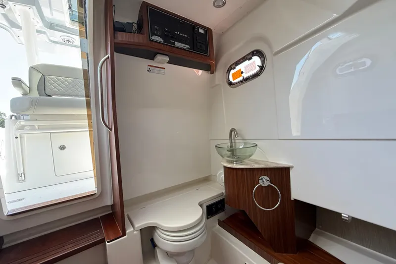 Slide: The Image of 2024 Pursuit S 328 Sport boat interior with modern bathroom amenities. - 47