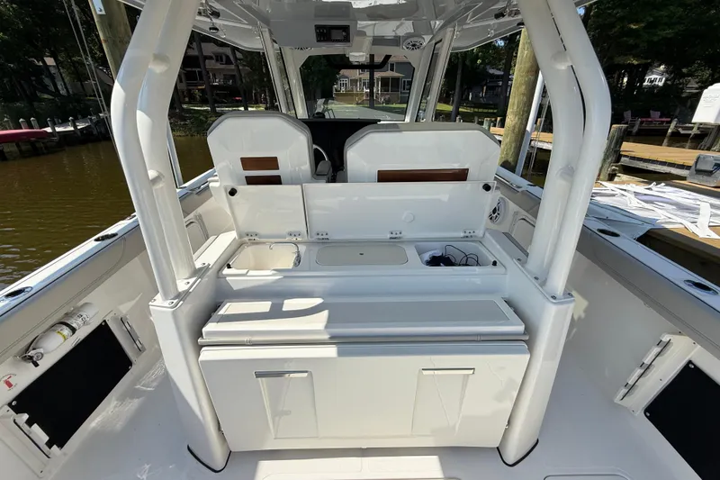 Slide: The Image of 2024 Pursuit S 328 Sport boat interior with seating and storage compartments. - 53