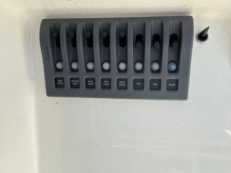 Slide: The Image of Control panel of a 1988 KenCraft Challenger 215 boat with labeled switches. - 8