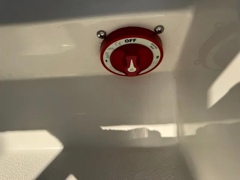 Slide: The Image of Red battery switch on 1988 KenCraft Challenger 215 boat. - 9