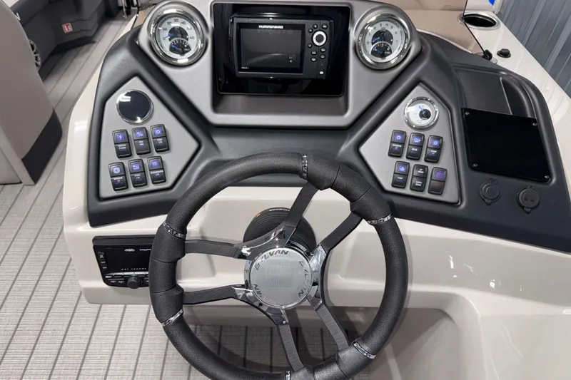 Slide: The Image of 2026 Sylvan L3 LZ boat dashboard with steering wheel and control panel. - 10