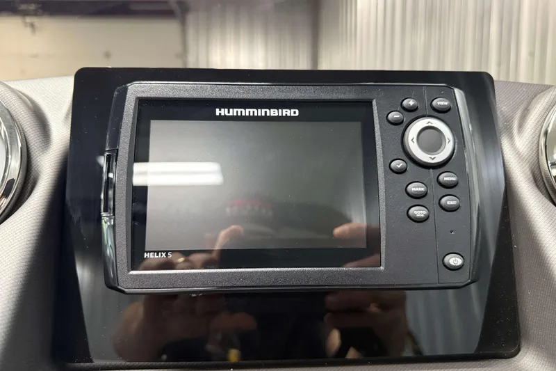 Slide: The Image of Humminbird Helix 5 fish finder on 2026 Sylvan L3 LZ boat dashboard. - 11
