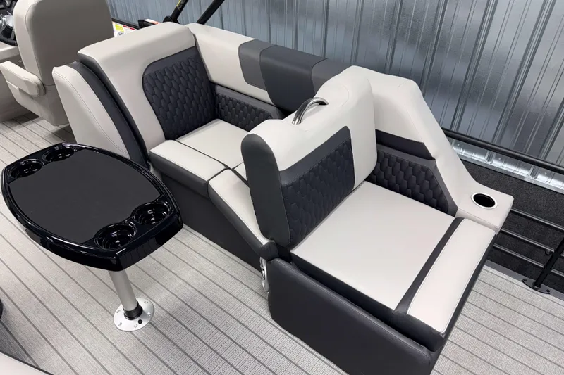 Slide: The Image of Luxurious seating in 2026 Sylvan L3 LZ boat with modern design and cup holders. - 14