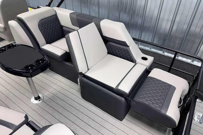 Slide: The Image of Luxurious seating on 2026 Sylvan L3 LZ pontoon boat with quilted upholstery and cup holders. - 16
