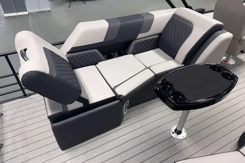 Slide: The Image of 2026 Sylvan L3 LZ boat interior with luxurious seating and sleek table design. - 17