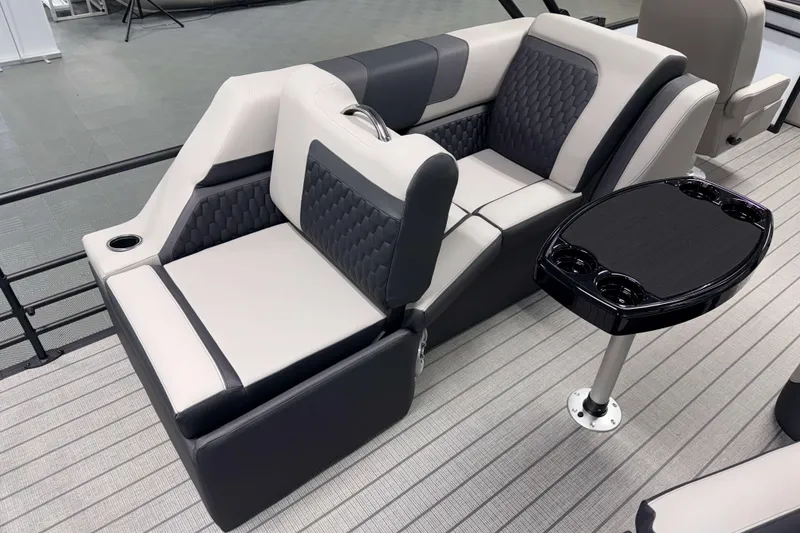 Slide: The Image of Luxurious seating on 2026 Sylvan L3 LZ boat with modern table and cup holders. - 18