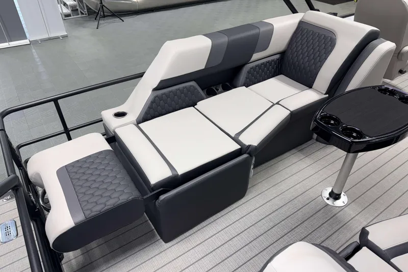 Slide: The Image of Luxurious seating on 2026 Sylvan L3 LZ pontoon boat with modern design and cup holders. - 19