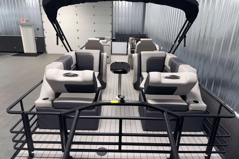 Slide: The Image of 2026 Sylvan L3 LZ pontoon boat interior with plush seating and modern design. - 21