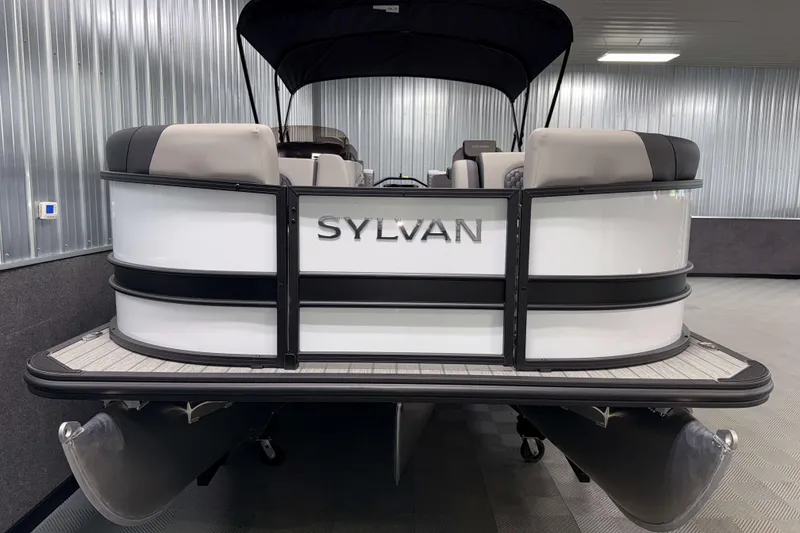 Slide: The Image of 2026 Sylvan L3 LZ pontoon boat in showroom, featuring sleek design and modern seating. - 23