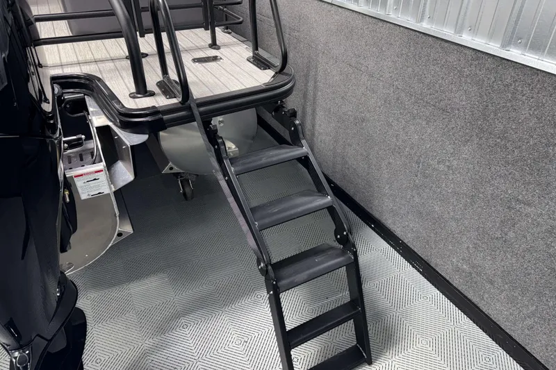 Slide: The Image of 2026 Sylvan L3 LZ boat with black ladder and sleek deck design. - 28