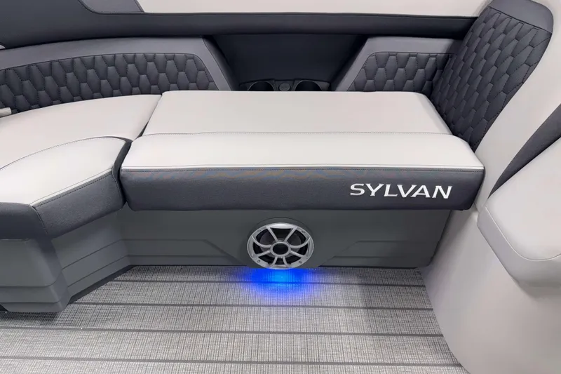 Slide: The Image of 2026 Sylvan L3 LZ boat interior with cushioned seating and blue LED lighting. - 3