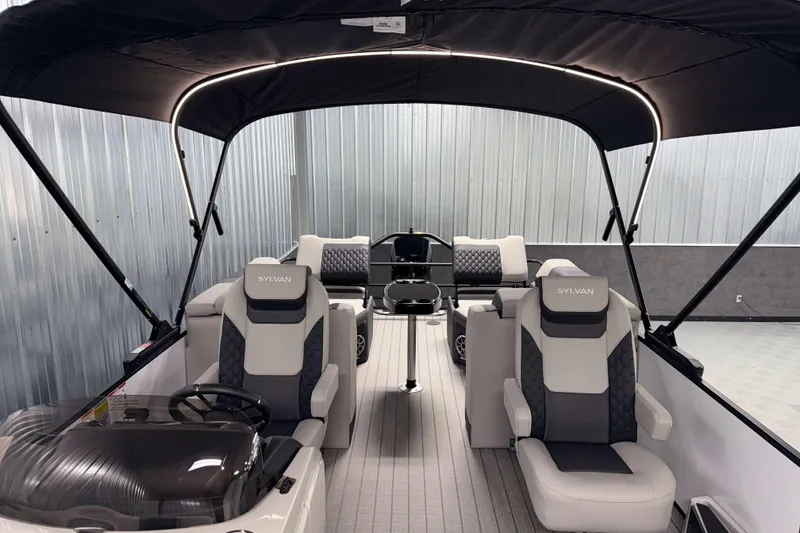 Slide: The Image of 2026 Sylvan L3 LZ pontoon boat interior with luxurious seating and canopy. - 6