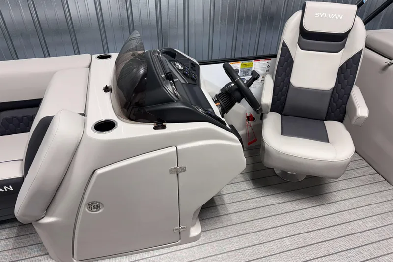 Slide: The Image of 2026 Sylvan L3 LZ boat interior with steering console and captain's chair. - 7