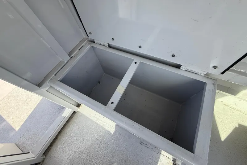 Slide: The Image of Open storage compartment on a 1996 Geo Marine 24ft Work Boat. - 12