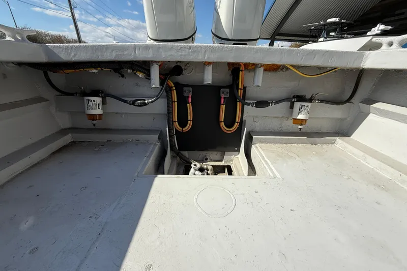 Slide: The Image of Interior view of a 1996 Geo Marine 24ft Work Boat, showcasing engine compartment. - 19