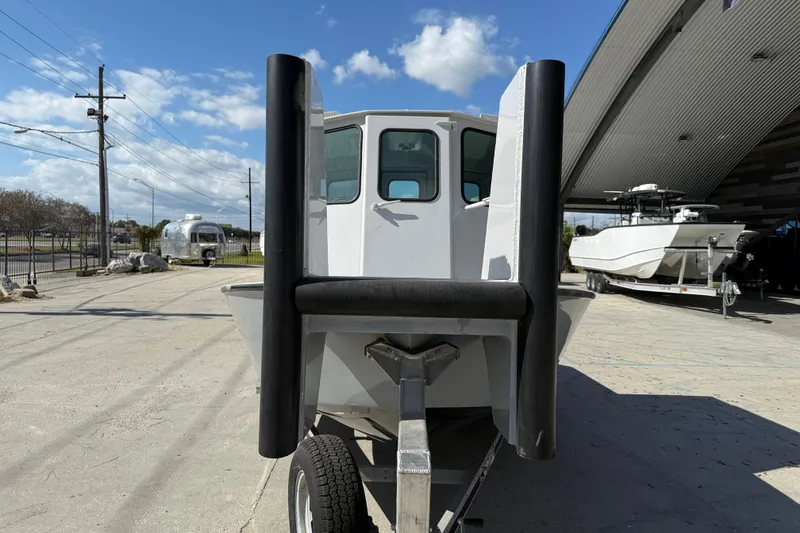 Slide: The Image of 1996 Geo Marine 24ft Work Boat on trailer, parked outdoors under blue sky. - 3