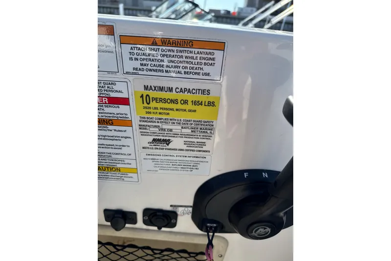 Slide: The Image of 2022 Bayliner VR6 Bowrider OB capacity warning label, maximum 10 persons or 1654 lbs. - 10