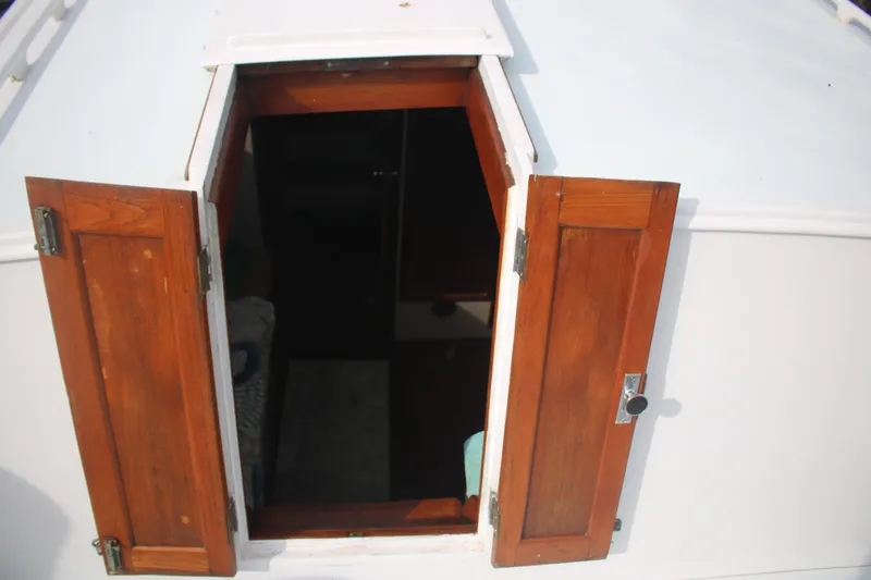 Slide: The Image of Wooden hatch door on 1974 Grand Banks 42 Classic boat, partially open. - 10