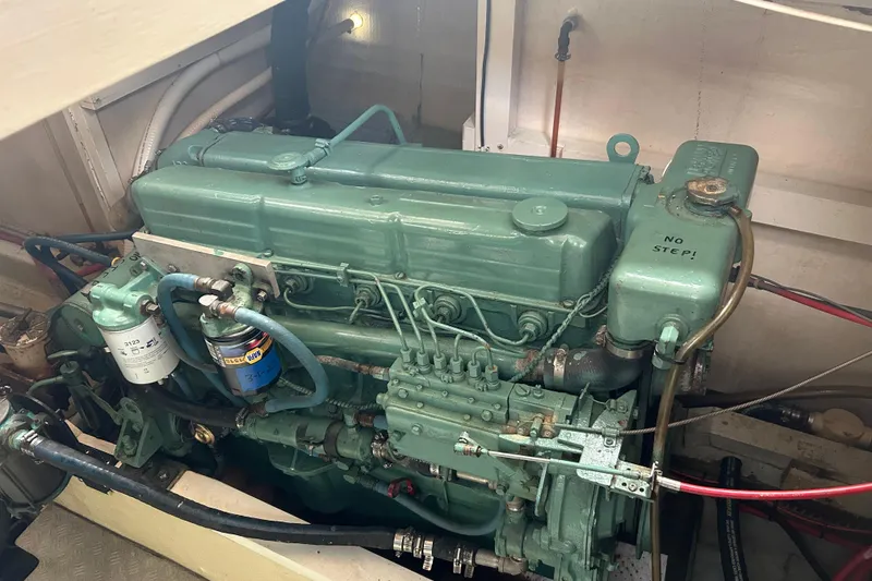 Slide: The Image of Engine of a 1974 Grand Banks 42 Classic boat, showcasing detailed components. - 14