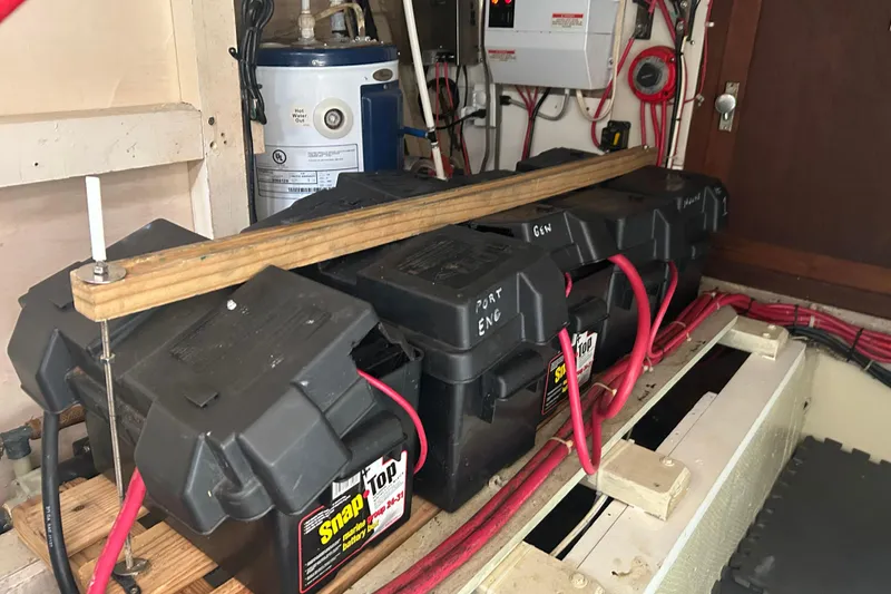 Slide: The Image of Battery compartment of a 1974 Grand Banks 42 Classic boat with wiring and equipment. - 19
